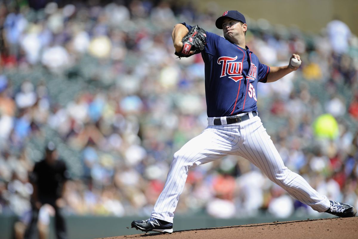 MINNEAPOLIS, MN - AUGUST 1: Scott Diamond #58 of the Minnesota Twins delivers a pitch against the Chicago White Sox during the first inning on August 1, 2012 at Target Field in Minneapolis, Minnesota. (Photo by Hannah Foslien/Getty Images)