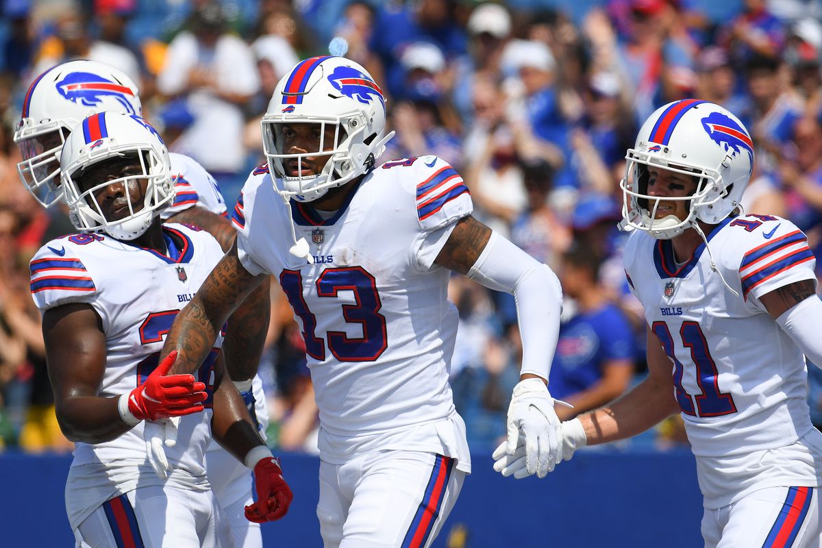 Buffalo Bills wide receiver Gabriel Davis (13) celebrates his touchdown with teammates running back Devin Singletary (26) and wide receiver Cole Beasley (11) against the Green Bay Packers during the first quarter at Highmark Stadium.