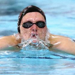 Jordan’s Trent Oldham wins the 100-yard breaststroke during the 6A boys swim championship at Kearns Oquirrh Park Fitness Center in Kearns on Saturday, Feb. 20, 2021.