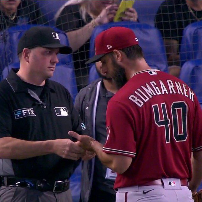 A still shot of Dan Bellino staring daggers into Madison Bumgarner before Madbum notices it and says somthing