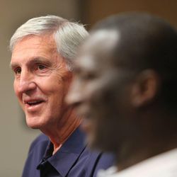 Former Jazz head coach Jerry Sloan, with current Jazz coach Tyrone Corbin in the foreground, talks to the media about his new role with the organization at a press conference at Zions Bank Basketball Center Thursday, June 20, 2013, in Salt Lake City. Sloan will be a senior basketball advisor for the team.