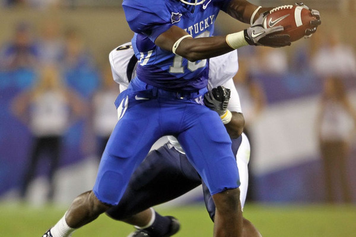 LEXINGTON KY - SEPTEMBER 18: La 'Rod King #16 of the Kentucky Wildcats reaches for extra yards during the game against the Akron Zips at Commonwealth Stadium on September 18 2010 in Lexington Kentucky.  (Photo by Andy Lyons/Getty Images)