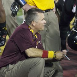Arizona State head coach Todd Graham talks with his players.