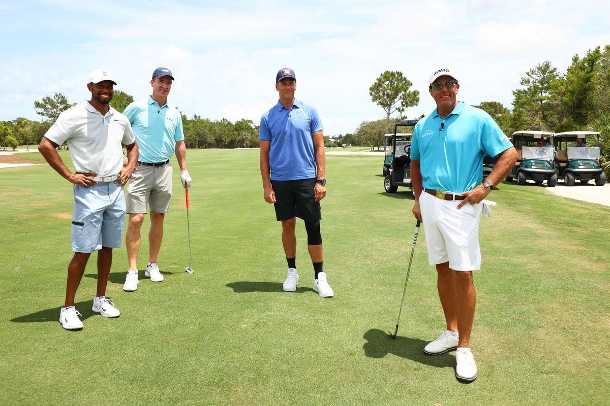 Tiger Woods, former NFL player Peyton Manning, NFL player Tom Brady of the Tampa Bay Buccaneers and Phil Mickelson pose for a photo during a practice round for The Match: Champions For Charity at Medalist Golf Club on May 23, 2020 in Hobe Sound, Florida.