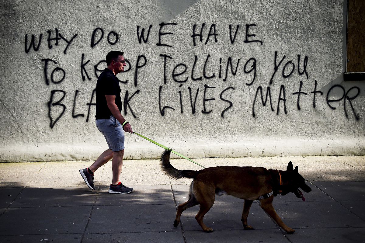 Graffiti near the White House reads, “Why do we have to keep telling you black lives matter?”