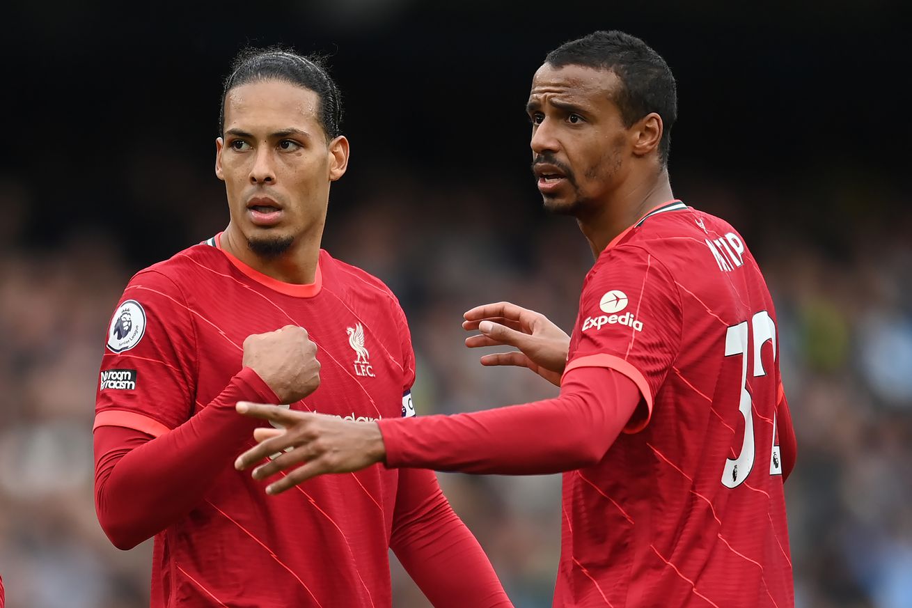 Virgil van Dijk and Joel Matip of Liverpool look on during the Premier League match between Manchester City and Liverpool at Etihad Stadium on April 10, 2022 in Manchester, England.