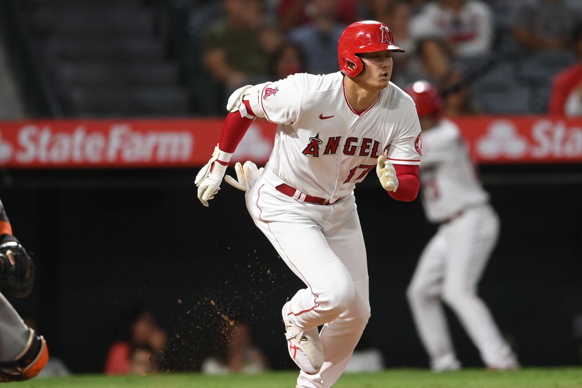 Shohei Ohtani of the Los Angeles Angels hits a single in the sixth inning of the game against the Houston Astros at Angel Stadium of Anaheim on September 21, 2021 in Anaheim, California.