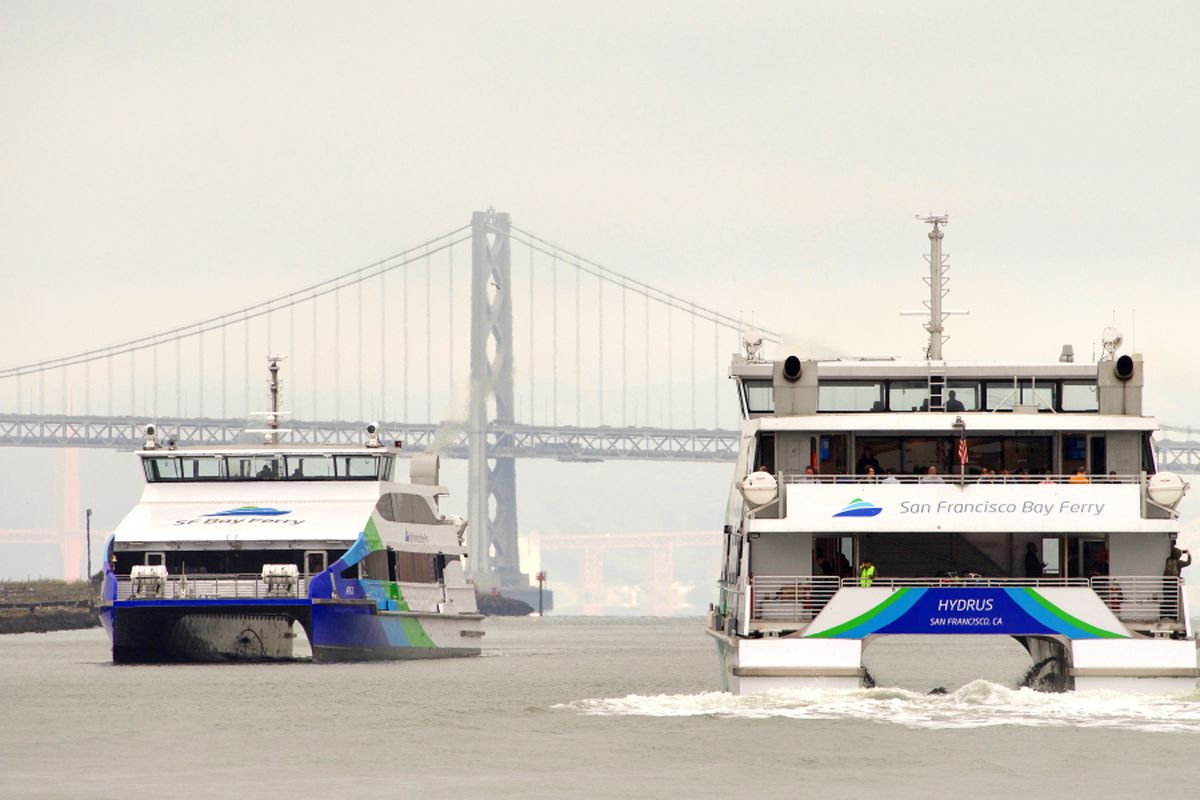 Ferries passing near the Bay Bridge.