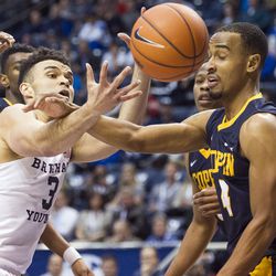 Brigham Young guard Elijah Bryant (3) reaches for the ball past Coppin State guard Tre' Thomas (4) during an NCAA college basketball game in Provo on Thursday, Nov. 17, 2016.