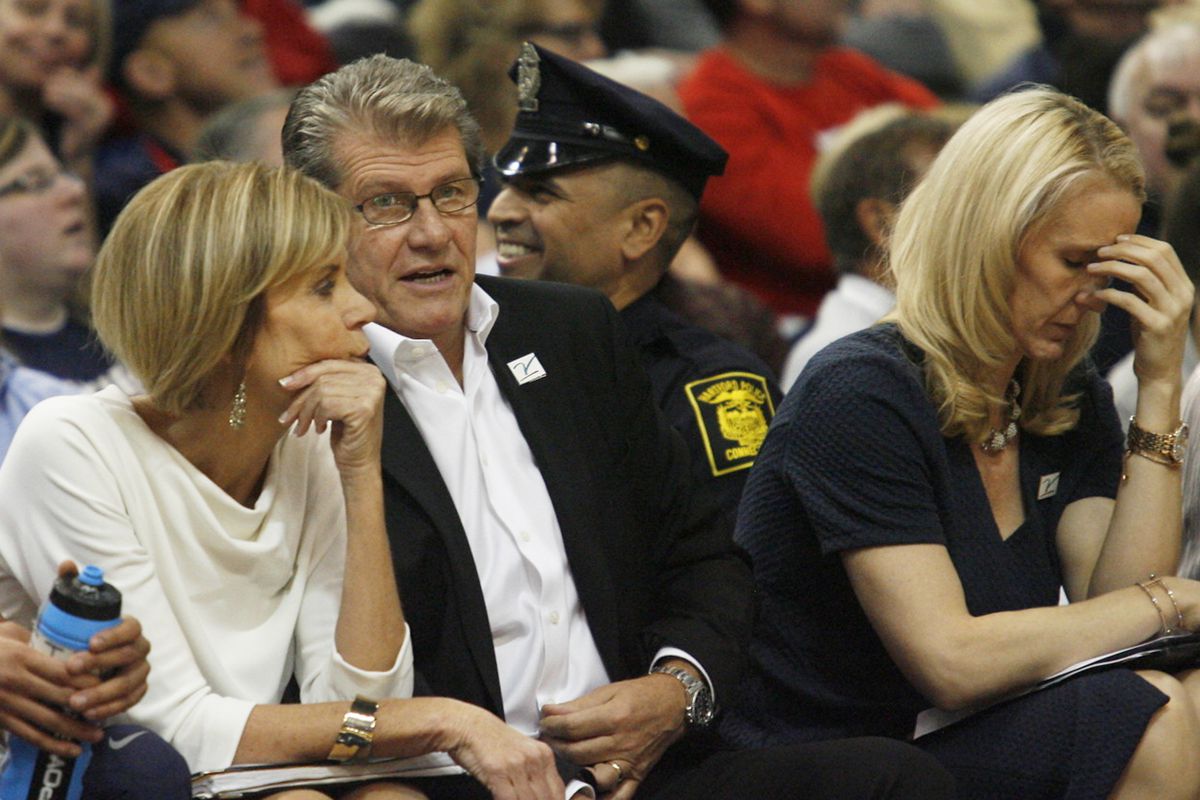 UConn head coach Geno Auriemma chats with UConn associate head coach Chris Dailey during the Notre Dame Fighting Irish vs UConn Huskies women's college basketball game in the Women's Jimmy V Classic at the XL Center in Hartford, CT on December 3, 2017.