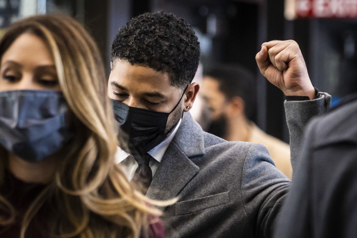 Former “Empire” star Jussie Smollett raises his fist as he walks into the Leighton Criminal Courthouse, Thursday morning, Dec. 2, 2021. The 39-year-old actor and singer was charged with lying to Chicago police in 2019 when he claimed he was the victim of a racist and anti-gay attack near his Streeterville apartment.