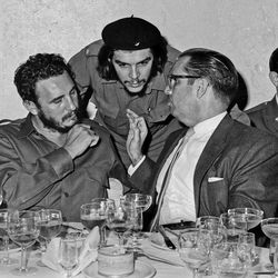 FILE - In this 1960 file photo, Cuba's revolutionary hero Ernesto "Che" Guevara, center, Cuba's leader Fidel Castro, left, and Cuba's President Osvaldo Dorticos, right, attend a reception in an unknown location in Cuba. Castro has died at age 90. President Raul Castro said on state television that his older brother died at 10:29 p.m. Friday, Nov. 25, 2016. 