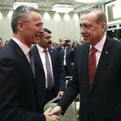 Turkey's President Recep Tayyip Erdogan, right, and NATO Secretary General Jens Stoltenberg shake hands as they attend a NATO parliamentary assembly meeting in Istanbul, Monday, Nov. 21, 2016. Erdogan has called on the United States and other nations to re-assess his country's proposal for the creation of a no-fly zone in northern Syria. Addressing the NATO meeting, Erdogan again criticized allies' reliance on Syrian Kurdish fighters to battle the Islamic State group.(Kayhan Ozer, Presidential Press Service, Pool photo via AP)
