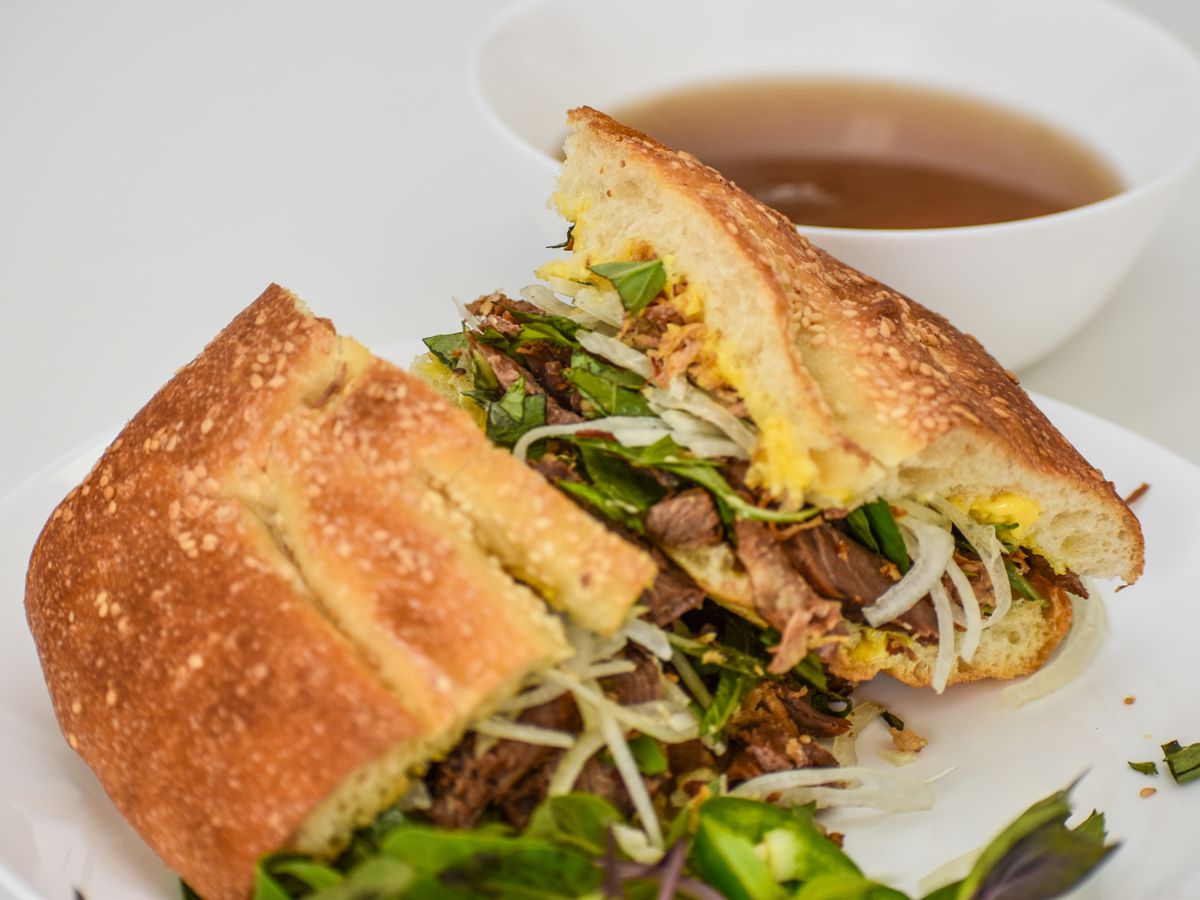 Pho French dip sandwich with a side of pho broth.