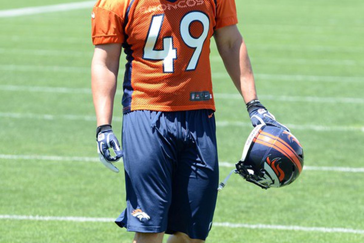 May 30, 2012; Englewood, CO, USA; Denver Broncos Fullback Chris Gronkowski walks off the field following organized team activities at the Broncos training facility. Mandatory Credit: Ron Chenoy-US PRESSWIRE