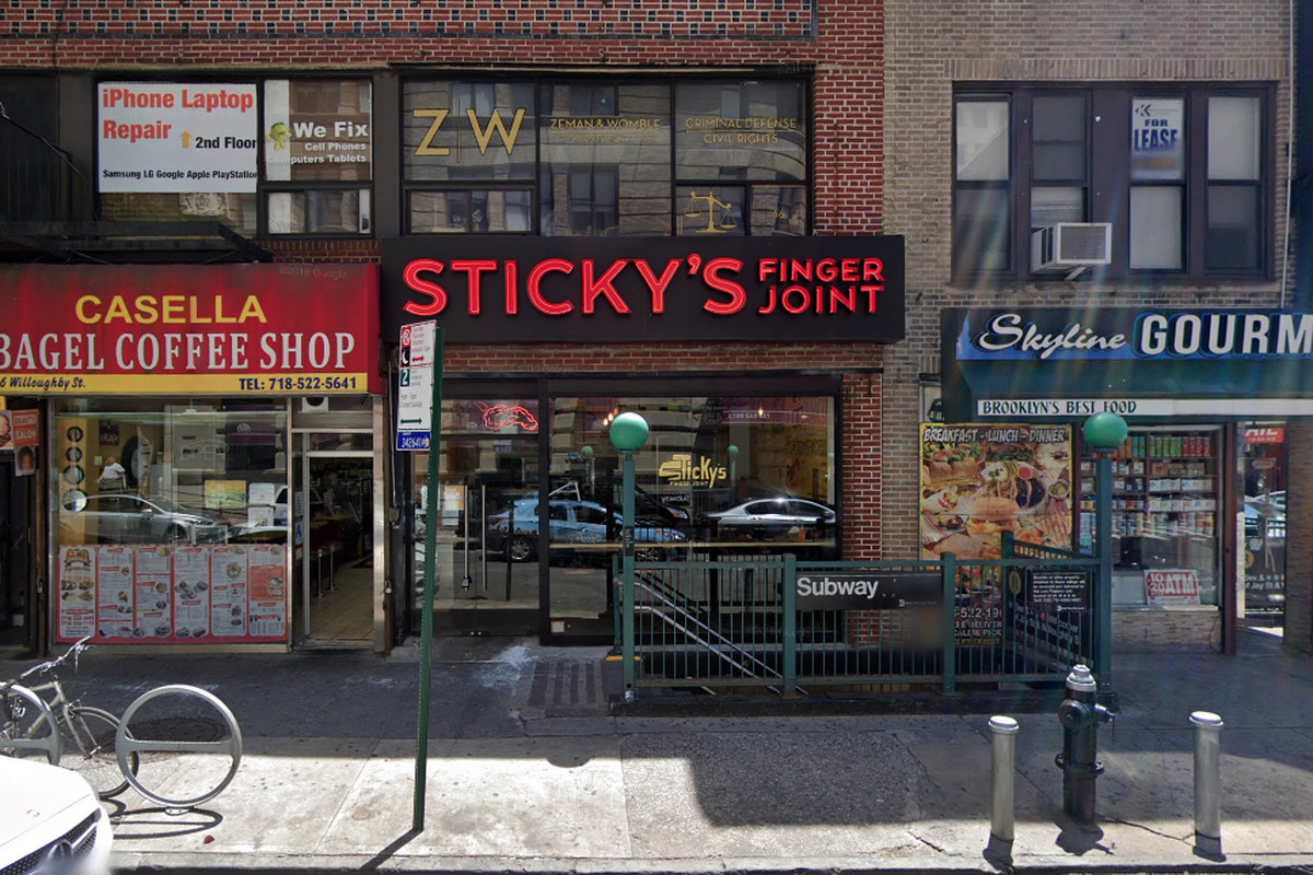 The exterior of a restaurant with “Sticky’s” in red block lettering
