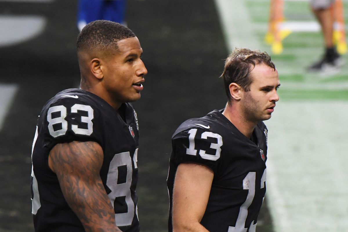 Darren Waller #83 and Hunter Renfrow #13 of the Las Vegas Raiders walk off the field after the team’s 30-23 loss to the Buffalo Bills in the NFL game at Allegiant Stadium on October 4, 2020 in Las Vegas, Nevada.
