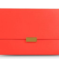 This sleek and minimalist eco faux nappa envelope clutch dubbed the Beckett Envelope Clutch from Stella McCartney ($770) in a lipstick pink tone comes with a slim flat shape and detachable wrist strap. The flap front closure features an engraved Stella Mc