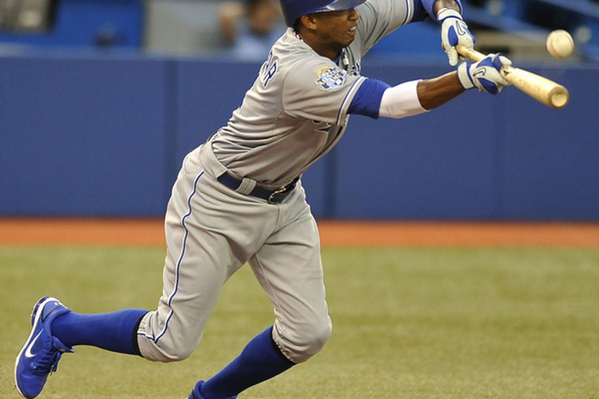 TORONTO, CANADA - JULY 4:  Alcides Escobar #2 of the Kansas City Royals bunts during MLB game action against the Toronto Blue Jays July 4, 2012 at Rogers Centre in Toronto, Ontario, Canada. (Photo by Brad White/Getty Images)