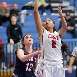 East High's Margarita Satini shoots in front of Brighton's Emily Moss during the first round of the 5A girls basketball championships at Salt Lake Community College in Taylorsville on Monday, Feb. 19, 2018. East won 49-37.