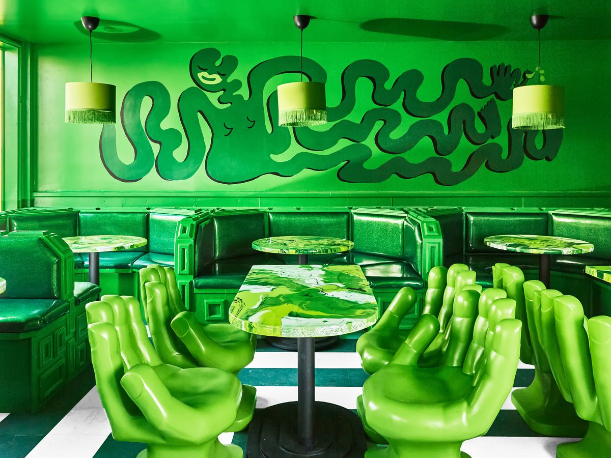 The monochromatic lime green dining room at Shuggie’s Trash Pie.