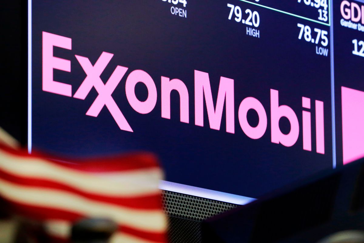 In this April 23, 2018, file photo, the logo for ExxonMobil appears above a trading post on the floor of the New York Stock Exchange.