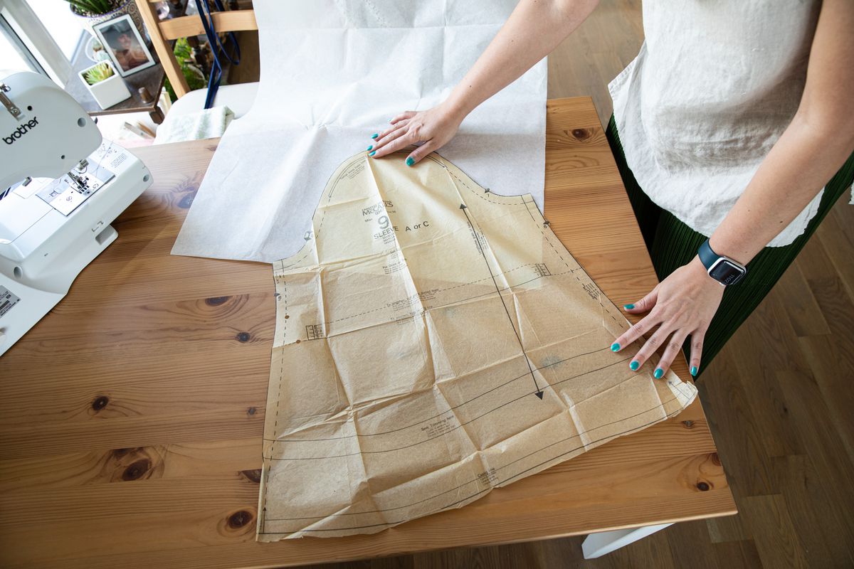 Verge reporter, Mia Sato works on a dress she is making from a vintage pattern at her makeshift sewing station - her dining room table - at her home in Brooklyn, NY. on June 9th, 2022