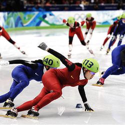 South Korea's Lee Eun-Byul chases China's Zhang Hui in the women's short-track speedskating 3,000m relay finals Wednesday at the 2010 Winter Olympics in Vancouver. South Korea was disqualified for impeding at the Olympics, and China won the gold.