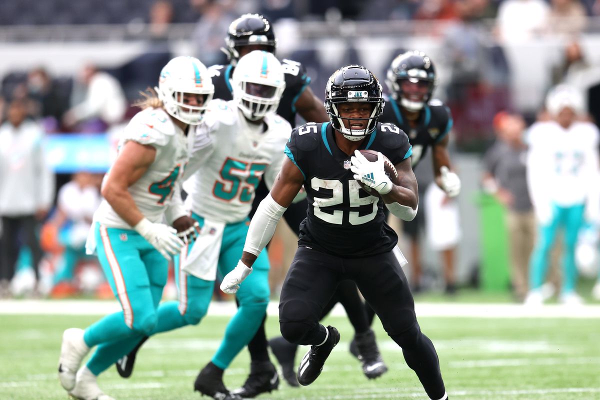 James Robinson of The Jacksonville Jaguars runs with the ball during the NFL London 2021 match between Miami Dolphins and Jacksonville Jaguars at Tottenham Hotspur Stadium on October 17, 2021 in London, England.