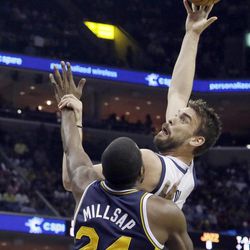 Memphis Grizzlies' Marc Gasol, of Spain, right, shoots over Utah Jazz's Paul Millsap (24) during the first half of an NBA basketball game in Memphis, Tenn., Wednesday, April 17, 2013. 