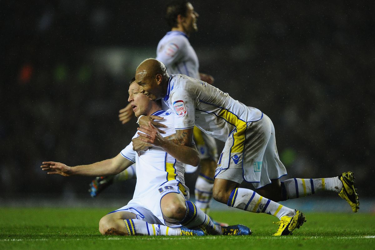 Diouf celebrates with goalscorer Becchio as Leeds go 1-0 up against Chelsea.