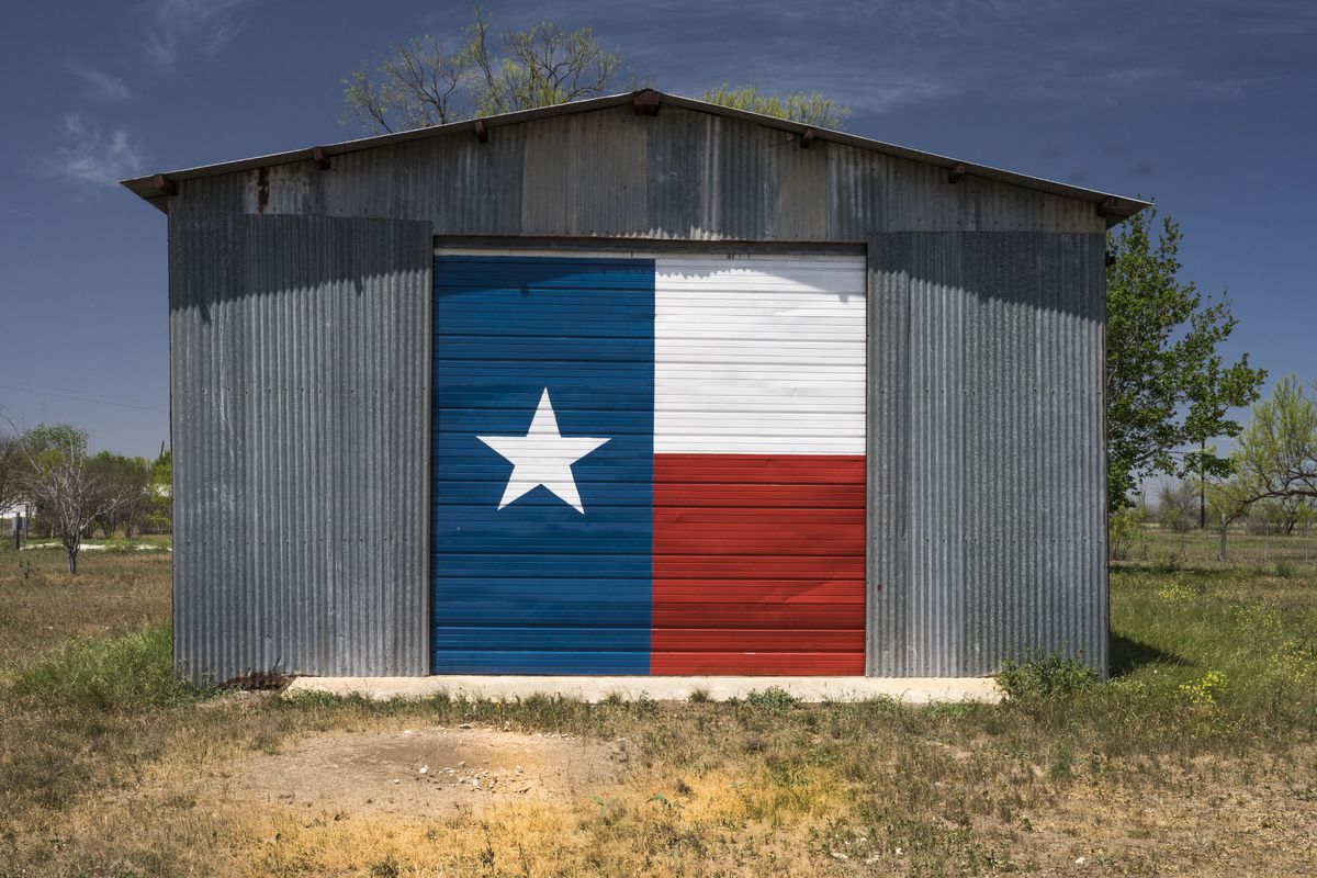 Aluminum shed boasts Texas Lone Star Flag, Texas