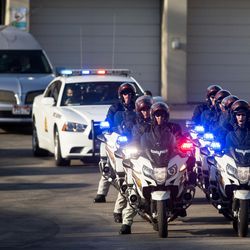 The body of Utah Highway Patrol Trooper Eric Ellsworth is transported from the State Medical Examiner's Office in Salt Lake City on Friday, Nov. 25, 2016.