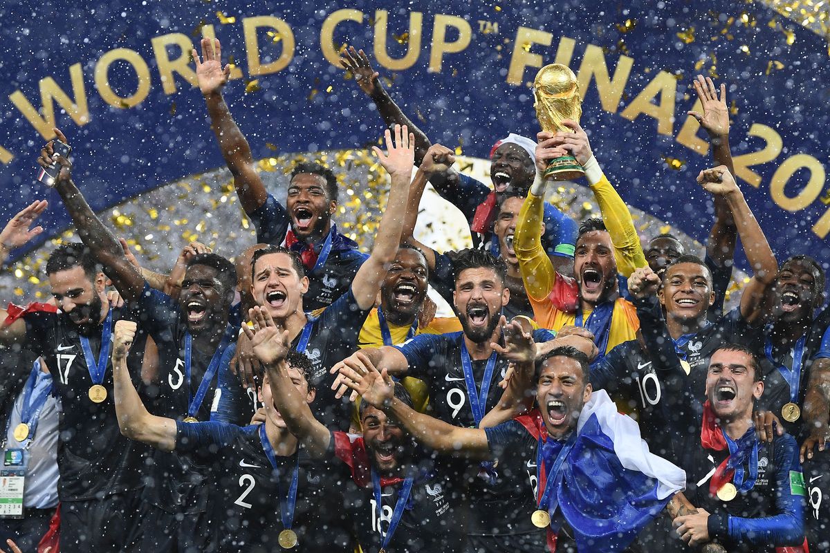 TOPSHOT - France’s players celebrate as they hold their World Cup trophy during the trophy ceremony at the end of the Russia 2018 World Cup final football match between France and Croatia at the Luzhniki Stadium in Moscow on July 15, 2018. (Photo by FRANCK FIFE / AFP) / RESTRICTED TO EDITORIAL USE - NO MOBILE PUSH ALERTS/DOWNLOADS
