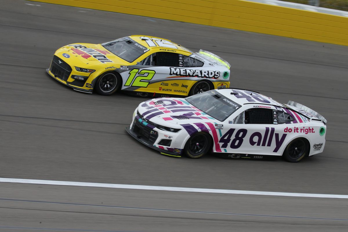 Alex Bowman (#48 Hendrick Motorsports Ally Chevrolet) bottom battles for position with Ryan Blaney (#12 Team Penske Menards\Pennzoil Ford) top during the Pennzoil 400 presented by Jiffy Lube NASCAR Cup Series race on March 6, 2022 at Las Vegas Motor Speedway in Las Vegas, Nevada.