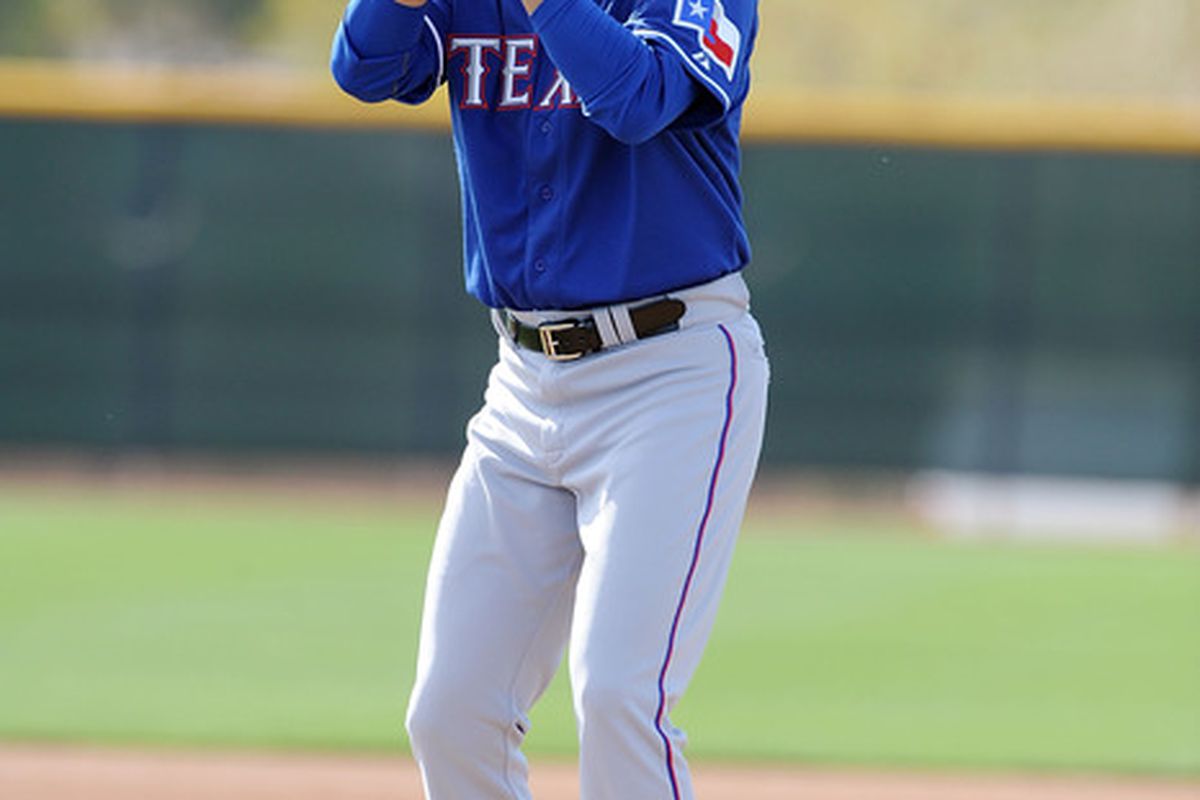 SURPRISE, AZ - FEBRUARY 23:  Yu Darvish #11 of the Texas Rangers throws from the mound during spring workouts at Surprise Stadium on February 23, 2012 in Surprise, Arizona.  (Photo by Norm Hall/Getty Images)