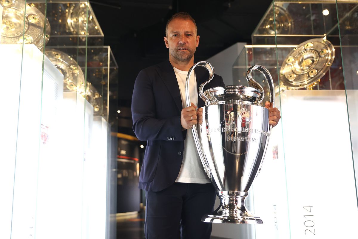 Hans-Dieter Flick Hands Over UEFA Champions League Trophy To FCB Museum