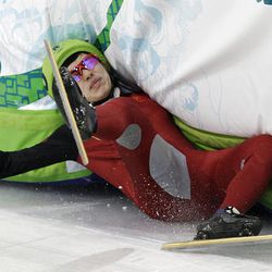 China's Nannan Zhao crashes during the eighth heat of the women's 500m short-track skating competition at the Vancouver 2010 Olympics on Saturday.