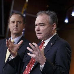 Sen. Tim Kaine, D-Va., right, accompanied by Rep. Adam Schiff, D-Calif., gestures during a news conference on Capitol Hill in Washington, Wednesday, Feb. 11, 2015, to reflect on President Barack Obama's request to Congress to authorize military force against Islamic State fighters, asking lawmakers to "show the world we are united in our resolve" to defeat militants who have overrun parts of the Middle East and threaten attacks on the U.S.  