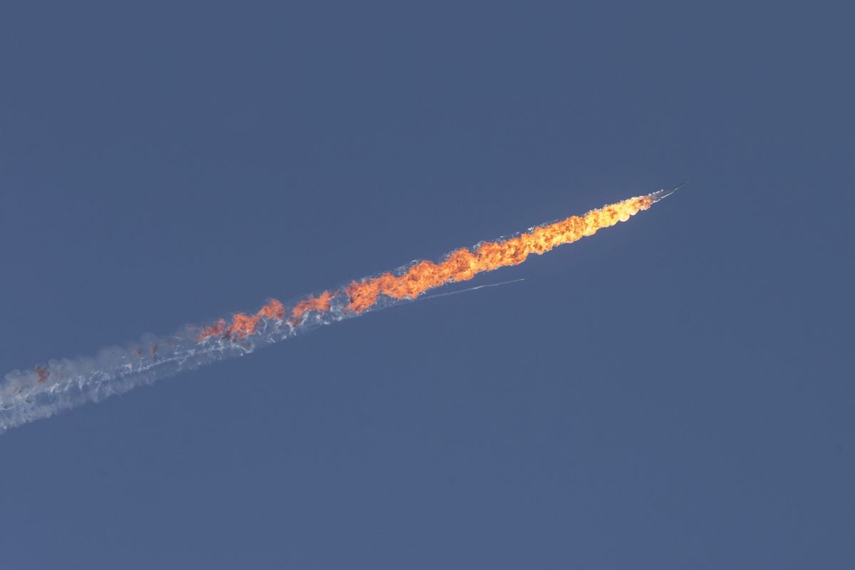 A Russian warplane goes down in Syria's northwestern Turkmen town of Bayirbucak near Turkey's border on November 24, 2015. 
