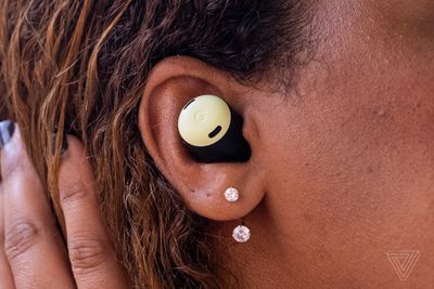 A photo of Google’s Pixel Buds Pro in a woman’s ear.