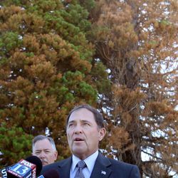 Gov. Gary Herbert makes a brief media announcement urging Utah’s residents to demonstrate extreme caution as Utah’s fire season begins at the Capitol in Salt Lake City on Friday, June 14, 2013. Utah State Fire Marshal Coy Porter, left, stands with the governor.