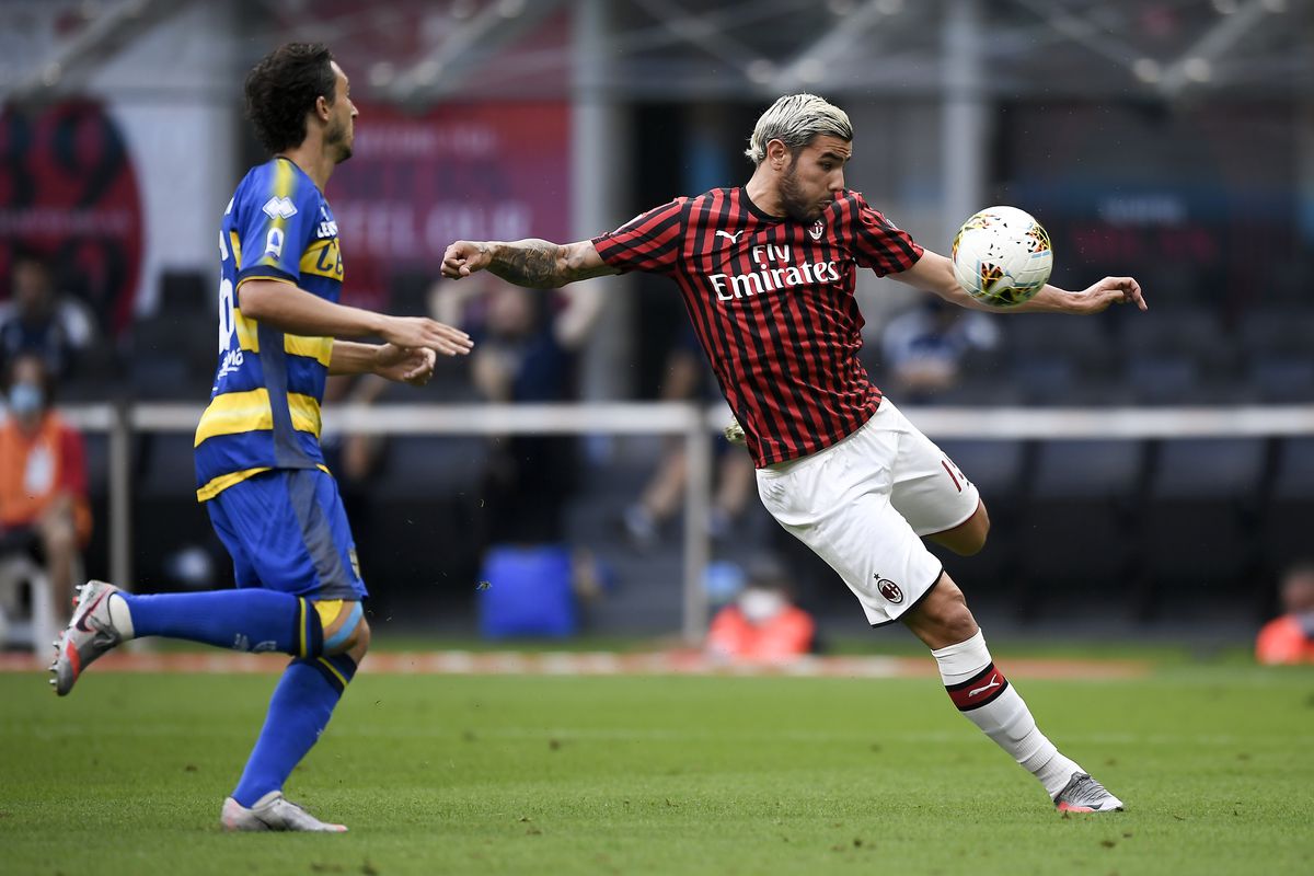 Theo Hernandez (R) of AC Milan kicks the ball during the...