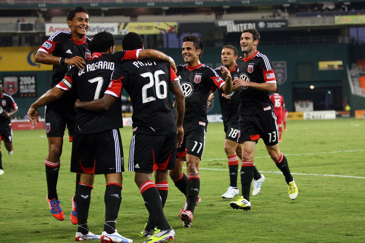 WASHINGTON, DC - AUGUST 4:  Dwayne De Rosario #7 of D.C. United celebrates with team-mates after scoring the opening goal against the Chicago Fire at RFK Stadium on August 22, 2012 in Washington, DC.(Photo by Ned Dishman/Getty Images)