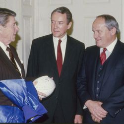 BYU head football coach LaVell Edwards talks with President Ronald Reagan and Sen. Orrin Hatch in 1994.