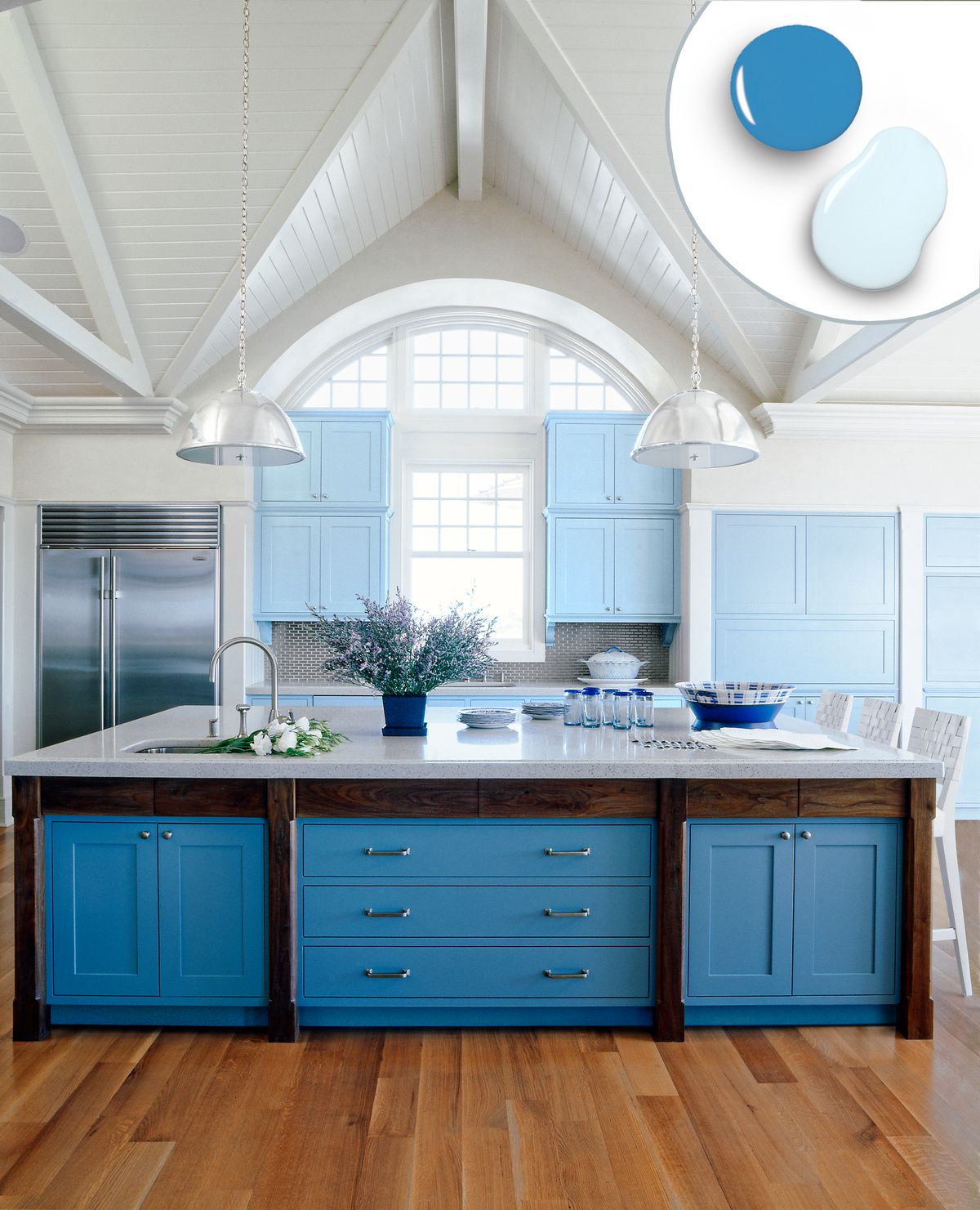 Kitchen island with built-in sky blue drawers and cabinets.