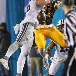 Brigham Young Cougars defensive back Gavin Fowler (16) breaks up a pass for Wyoming Cowboys tight end Austin Fort (81) during the Poinsettia Bowl in San Diego on Wednesday, Dec. 21, 2016. BYU won 24-21.