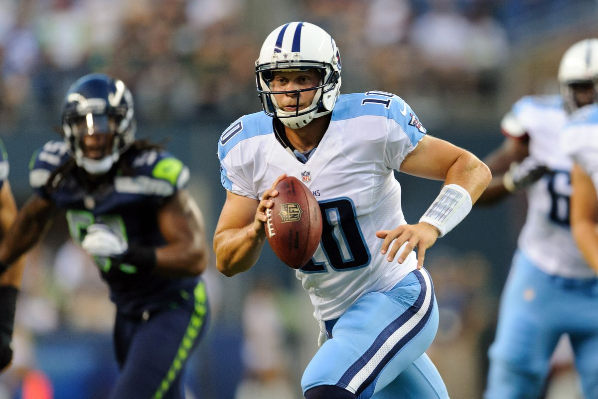 Aug 11, 2012; Seattle, WA, USA; Tennessee Titans quarterback Jake Locker (10) runs with the ball and looks for an open receiver during the 1st half against the Seattle Seahawks at CenturyLink Field. Mandatory Credit: Steven Bisig-US PRESSWIRE