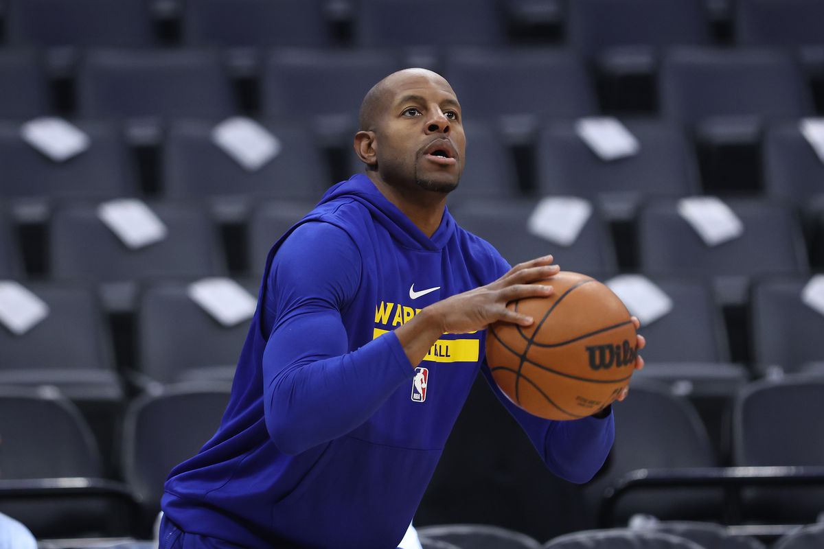 Andre Iguodala shooting in a warm-up jersey.