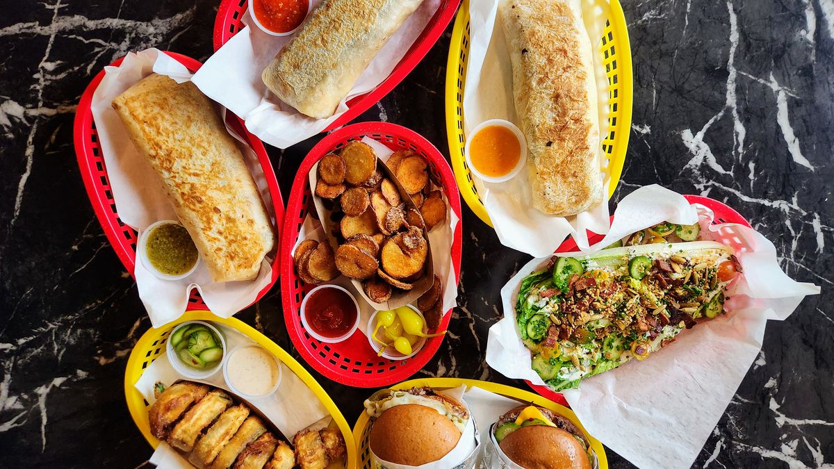 An assortment of burgers, salads, burritos, and fries from SolRad restaurant in Southern California.